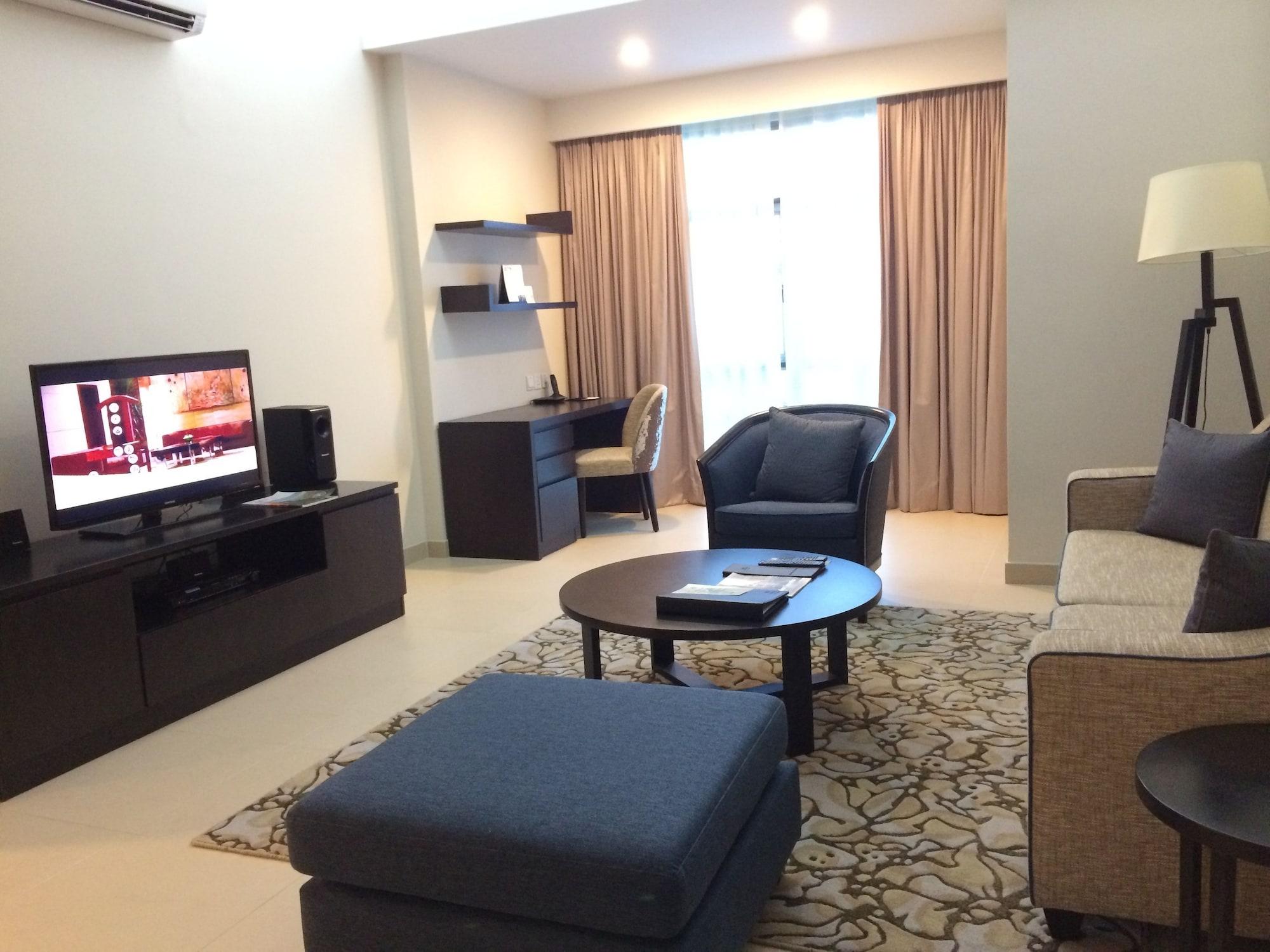 Somerset Хошимин Экстерьер фото Living room of a suite at the hotel