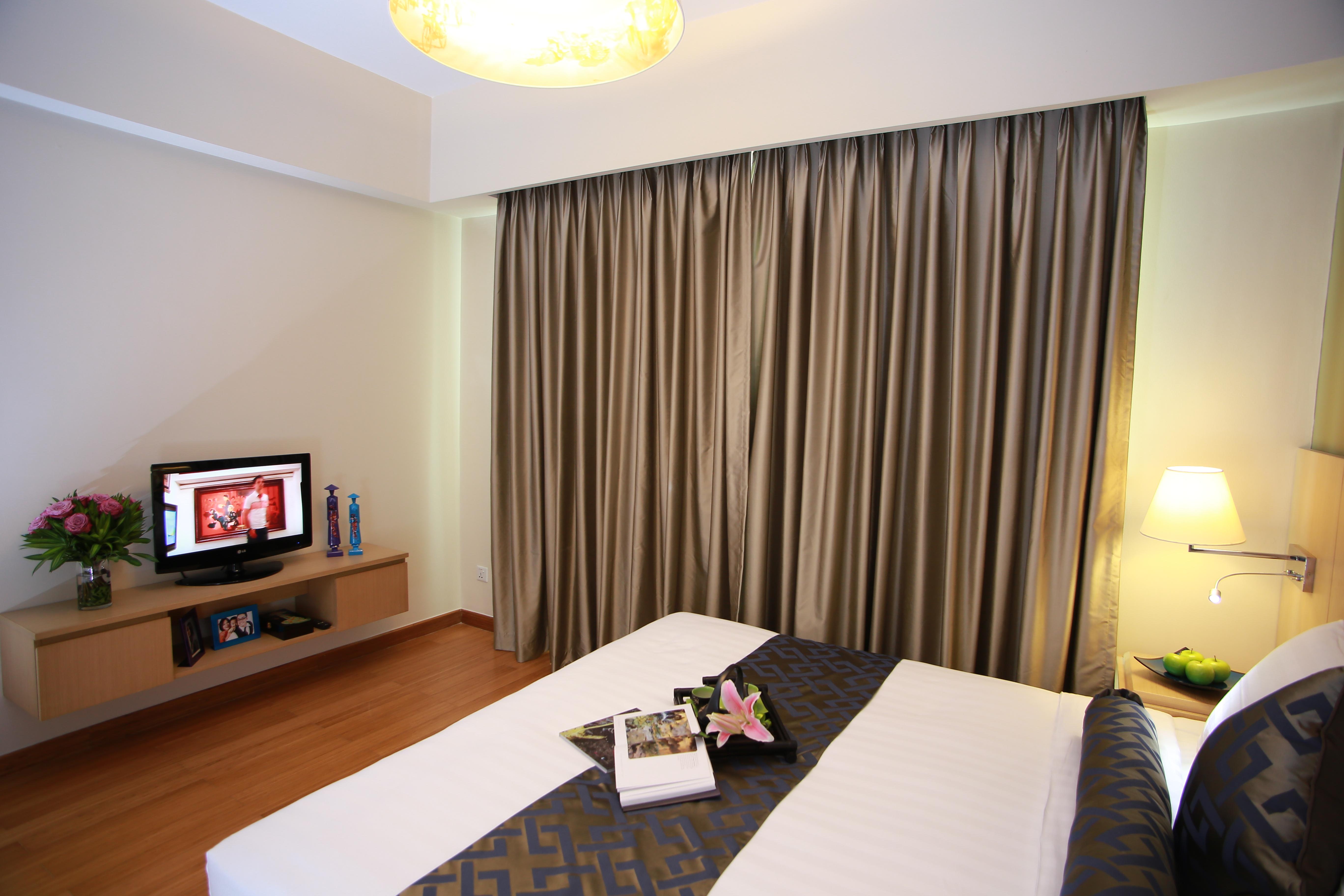 Somerset Хошимин Экстерьер фото A bedroom at the hotel